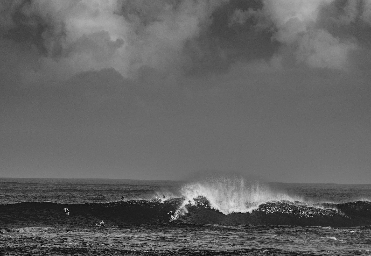 a man riding a wave in the ocean